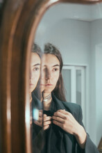 Portrait Of A Beautiful Girl In The Reflection Of The Mirror 