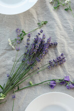 Plates On The Table Decorated With Lavender Flowers