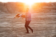 © Milles Studio/Stocksy - Father playing with daughter in desert