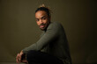 © Jayme Burrows/Stocksy - Portrait of a Male Model Against Seamless
