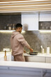 © Oleksii Syrotkin/Stocksy - Man cooking snack for lunch