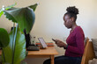 © Anna Berkut/Stocksy - female entrepreneur, woman freelancer with smartphone, work from home