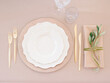 © Julia K/Stocksy - Top View Dishware And Cutlery On Beige Table