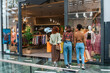 © Manu Prats/Stocksy - Multiracial women looking into a shop window