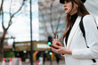 © Mauro Grigollo/Stocksy - Woman writing things to do list outdoor