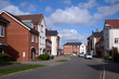 © Rowena Naylor/Stocksy - Mixed housing styles in modern development