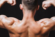 © Oleksii Syrotkin/Stocksy - Athletic back of muscular male trainer