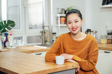 Asian Woman At Home