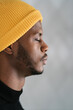 © Ezequiel Giménez/Stocksy - Calm black hipster in hat