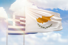 Sunny Blue Sky And Flags Of Cyprus And Greece
