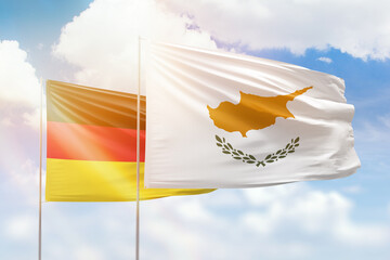 Sunny blue sky and flags of cyprus and germany