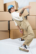 © María Soledad Kubat/Stocksy - Studio portrait of funky, excited latin young man