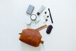 © Christina Hussey/Stocksy - Men's Leather Toiletry Cosmetic Bag with Self Care Products From Above