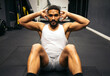 © Pedro Merino/Stocksy - Man doing crunches