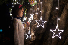 Closeup Chinese Little Girl Under The Star Lights

