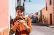 © Hugo Fuentes/Stocksy - Stylish Hispanic Man Texting On His Phone