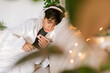© ByLorena/Stocksy - Teenager with flu entertaining at home
