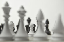 Chess Figures With A White Pawn In The Focus.