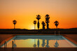© Marcos Osorio/Stocksy - Pool with reflections at sunset