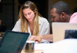 © Guille Faingold/Stocksy - Multiracial colleagues analyzing documents
