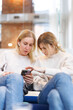 © Oleksii Syrotkin/Stocksy - Women having conversation about news