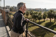 © Lupe Rodríguez/Stocksy - 70-year-old senior man looking at the city landscape