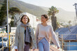 © Juno/Stocksy - Sisters walking and talking together
