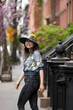 © Lauren Lee/Stocksy - Woman looking back and smiling