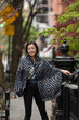 © Lauren Lee/Stocksy - Mature woman in her neighborhood