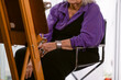 © ByLorena/Stocksy - Cropped elder woman painting at home