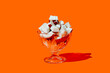 © Juan Moyano/Stocksy - glass with some pieces of natural coconut