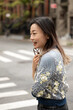 © Lauren Lee/Stocksy - Happy woman in neighborhood