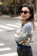 © Lauren Lee/Stocksy - Happy woman in neighborhood