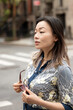 © Lauren Lee/Stocksy - Woman in the street
