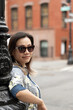 © Lauren Lee/Stocksy - Happy woman in street