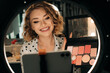© Olga Moreira/Stocksy - Female make up artist teaching online