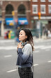 © Lauren Lee/Stocksy - Woman on the go in city