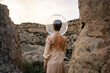 © Luis Velasco/Stocksy - Woman With Dress And Transparent Helmet In The Desert.