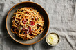 © Darina Kopcok/Stocksy - Single Bowl of Spaghetti with Tomato Sauce Horizontal Shot