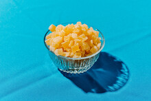 Dried Pineapple, Cut In Dices, In A Glass Bowl