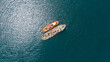drone view of two tugboats moored together,  top-down shot