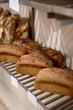 © Javier Díez/Stocksy - Loaves of bread in bakery