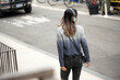 © Lauren Lee/Stocksy - Woman commuting with headphones