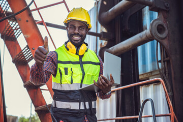 African black engineer worker portrait happy smile hand sign thumbs up for positive expression.