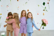 © Tatiana Timofeeva/Stocksy - Portrait of a Group of stylish Children