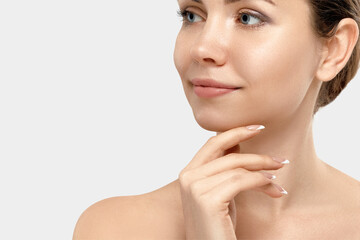Wall Mural - Beautiful woman portrait, skin care concept, beautiful skin. Portrait of female hands with manicure nails