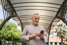 Old Man With Mobile Phone Outdoors