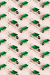 © Giada Canu/Stocksy - vertical pattern of many green rake and wheelbarrow