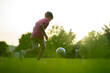 © Santi Nuñez/Stocksy - Unrecognizable boy playing football