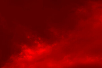 Red cloud texture background. Blurred photo of red sky with clouds. Photo can be used for galaxy space, New Year, Christmas and all celebrations backgrounds.